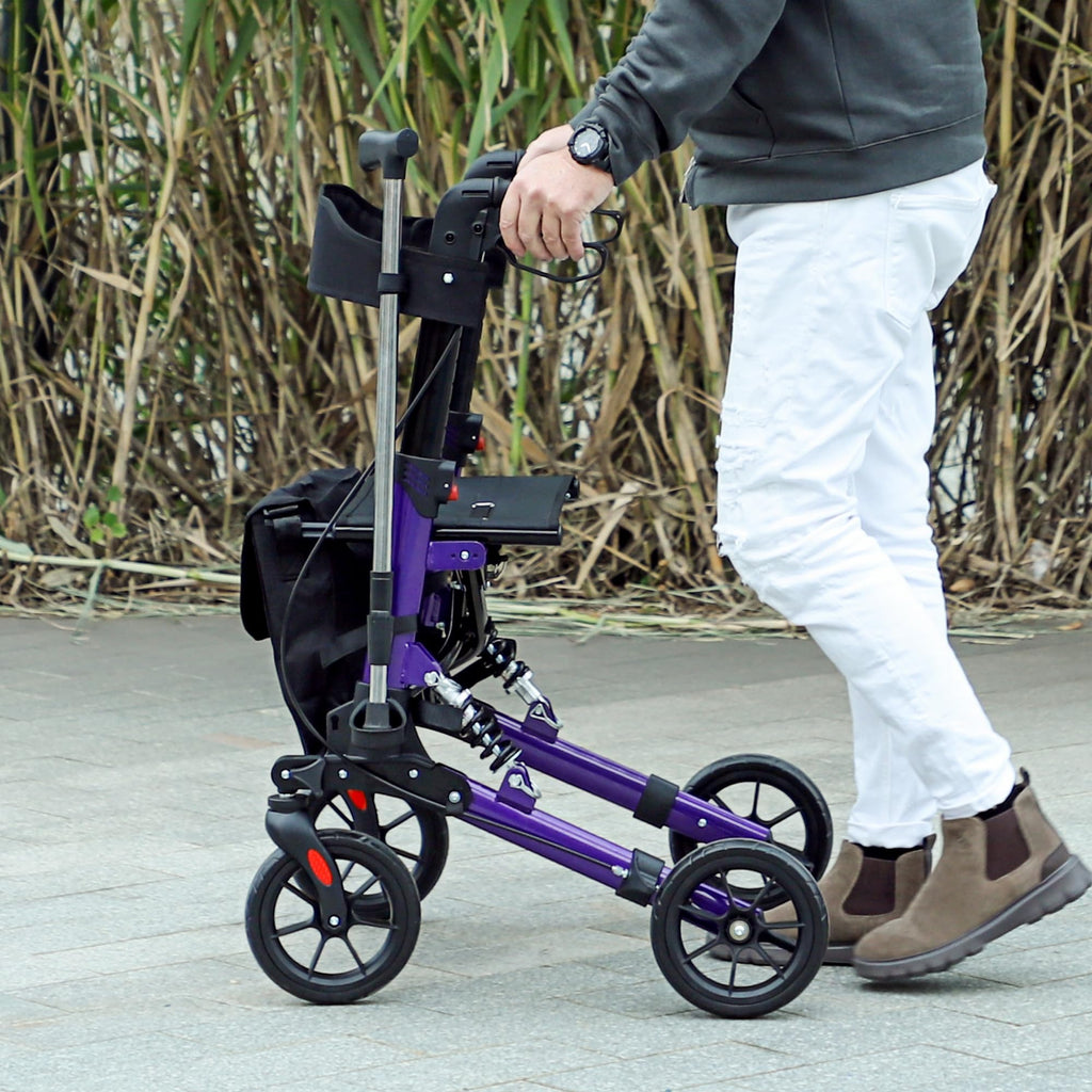 Homcom Folding Rollator Walker with Seat and Backrest Lightweight 4 Wheel Walking Frame with Storage Bag Suspension and Dual Brakes Purple - Like New