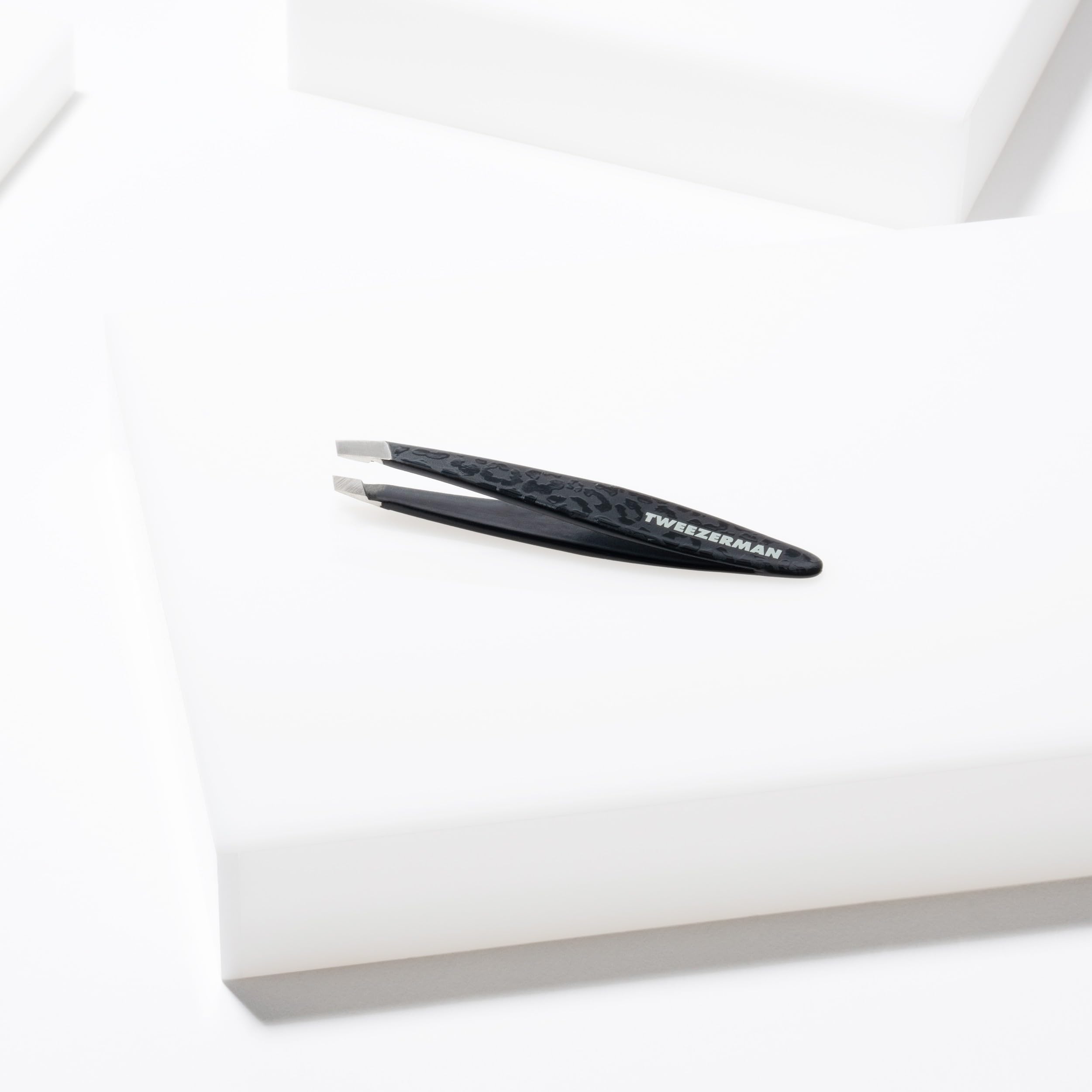 Tweezerman Black Leopard Mini Slant Tweezer, Professional Stainless Steel Precision Tweezers for Facial Hair and Eyebrows, with Travel Case, (Pack of 1)