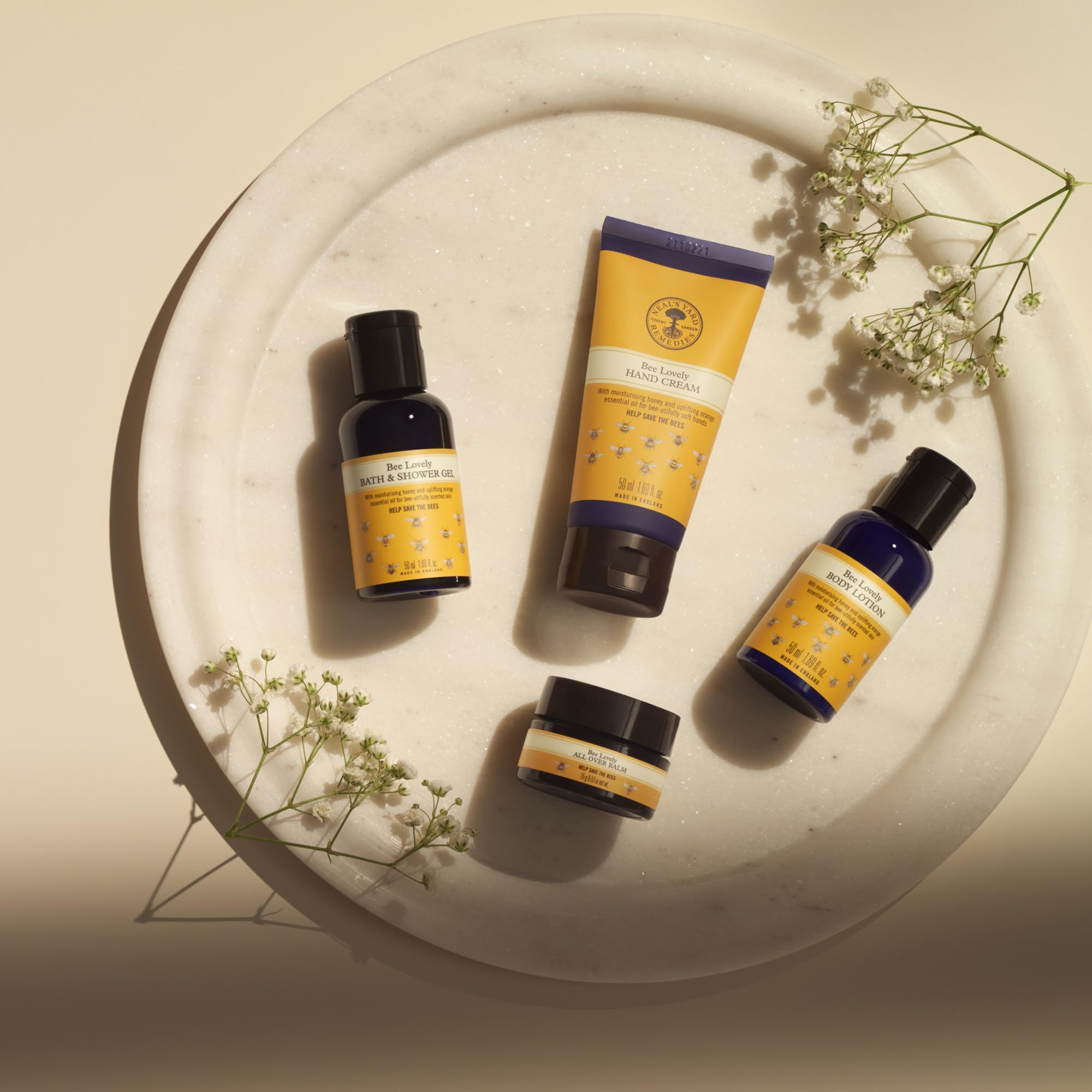 Neal's Yard Remedies | Bee Lovely Nourishing Collection | Set of Hand Cream, Shower Gel, Body Lotion & All Over Balm | Gifts for Women | Pack of 4 - Damaged Box